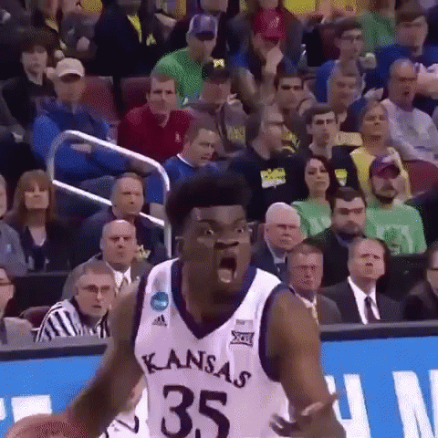 A Basketball Player With The Number 35 On His Jersey Is Screaming In Front Of A Crowd GIF