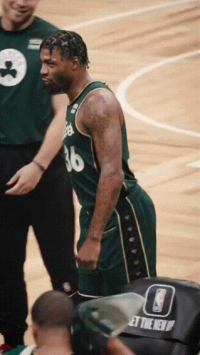 A Basketball Player With The Number 36 On His Jersey Stands On The Court GIF