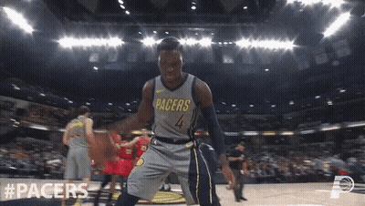 A Basketball Player With The Number 4 On His Jersey Is Dancing On The Court GIF