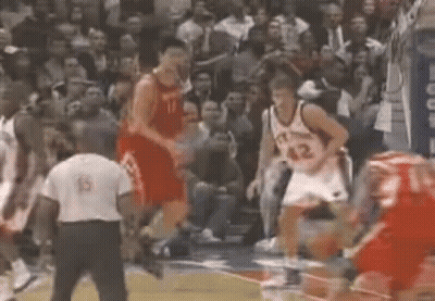 A Basketball Player With The Number 42 On His Back Jumps In The Air GIF