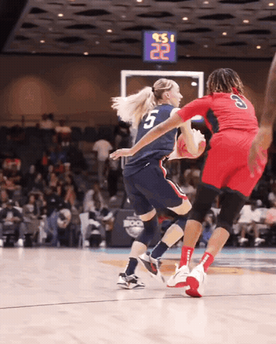 A Basketball Player With The Number 5 On Her Jersey Is Dribbling The Ball GIF