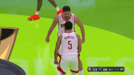 A Basketball Player With The Number 5 On His Back Stands Next To Another Player GIF