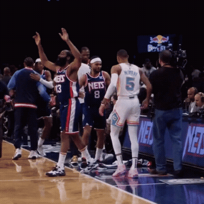 A Basketball Player With The Number 5 On His Back Stands On The Court GIF
