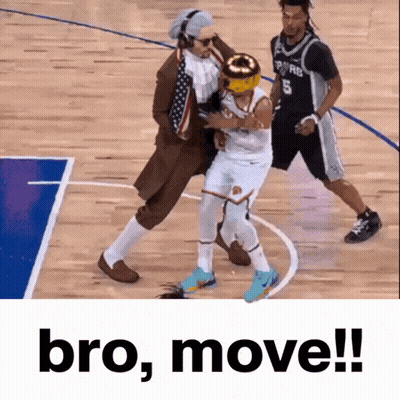 A Basketball Player With The Number 5 On His Jersey Is Being Fouled By A Man In A Suit GIF