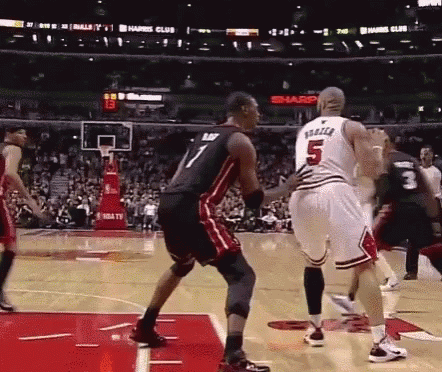 A Basketball Player With The Number 5 On His Jersey Is Standing On The Court GIF