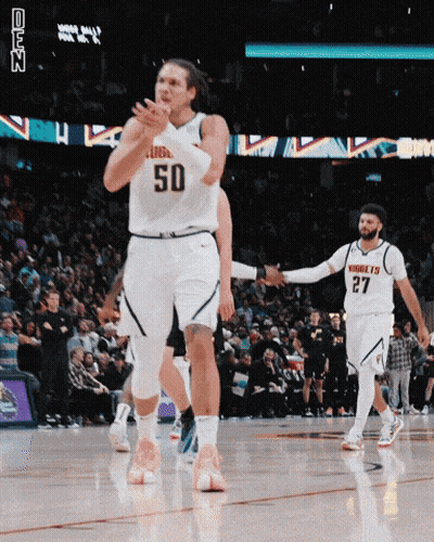 A Basketball Player With The Number 50 On His Jersey Is Clapping GIF