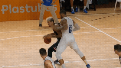 A Basketball Player With The Number 6 On His Jersey Dribbles The Ball GIF