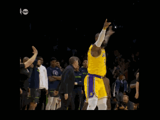A Basketball Player With The Number 6 On His Jersey Stands In Front Of A Crowd GIF