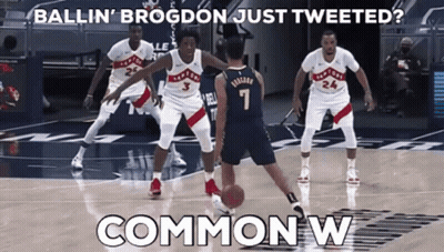 A Basketball Player With The Number 7 On His Jersey Dribbles The Ball GIF