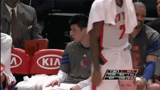 A Basketball Player With The Number 7 On His Jersey Is Talking To A Kid GIF