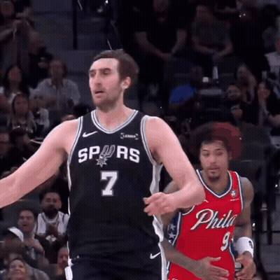 A Basketball Player With The Number 7 On His Jersey Stands In Front Of A Philadelphia Player GIF