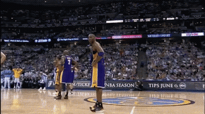 A Basketball Player With The Number 7 On His Jersey Stands On A Court GIF