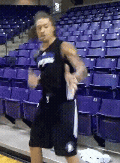 A Basketball Player With The Number 7 On His Shorts Is Dancing GIF