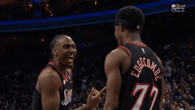A Basketball Player With The Number 77 On His Back Is Laughing GIF