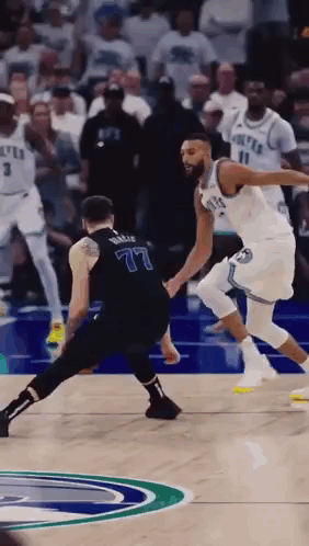 A Basketball Player With The Number 77 On His Back GIF