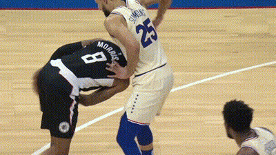 A Basketball Player With The Number 8 On His Back Is Being Tackled By Another Player GIF