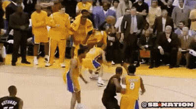 A Basketball Player With The Number 8 On His Jersey Is Being Fouled GIF