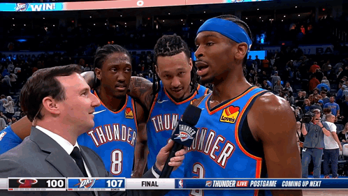 A Basketball Player With The Number 8 On His Jersey Is Being Interviewed GIF
