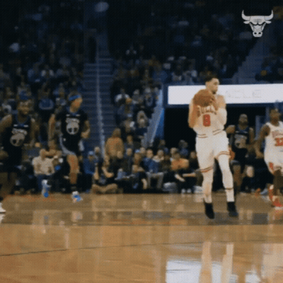 A Basketball Player With The Number 8 On His Jersey Is Holding A Basketball GIF