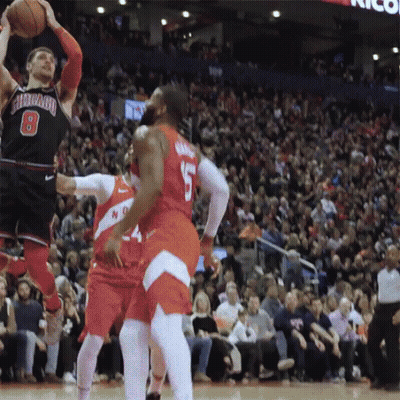 A Basketball Player With The Number 8 On His Jersey Is Jumping To Catch The Ball GIF