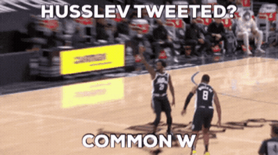 A Basketball Player With The Number 8 On His Jersey Is Talking To Another Player GIF