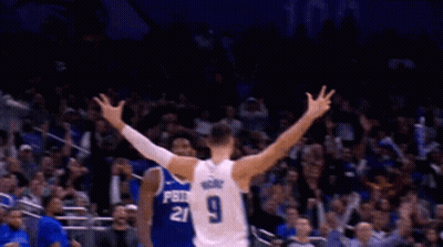 A Basketball Player With The Number 9 On His Back Is Celebrating GIF