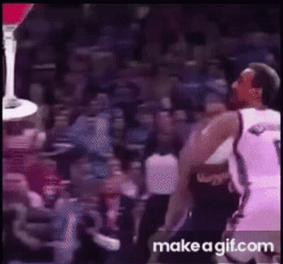 A Basketball Player With The Number 9 On His Jersey Is Jumping In The Air GIF