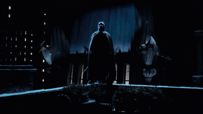 A Bat Is Flying In A Dark Room With Lots Of Windows GIF