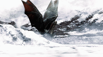 A Bat Is Flying Over A Snow Covered Landscape GIF