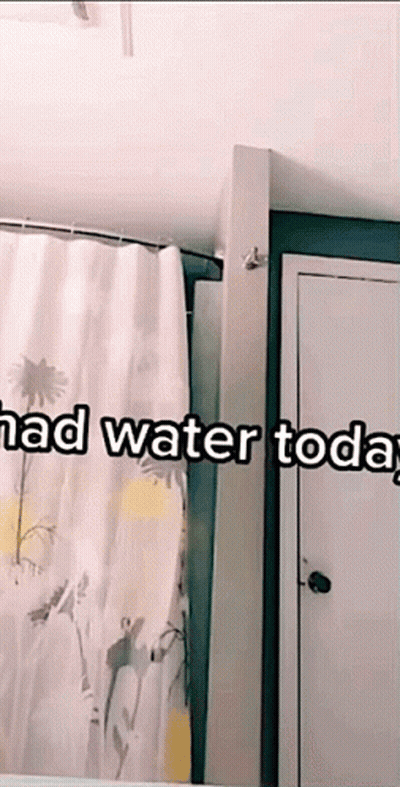 A Bathroom With A Shower Curtain And The Words " Had Water Today " On The Bottom GIF