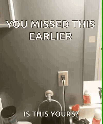 A Bathroom With A Sign That Says You Missed This Earlier GIF