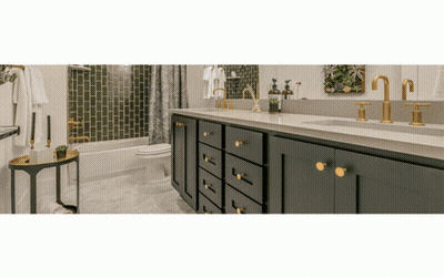 A Bathroom With Two Sinks A Toilet And A Bathtub GIF