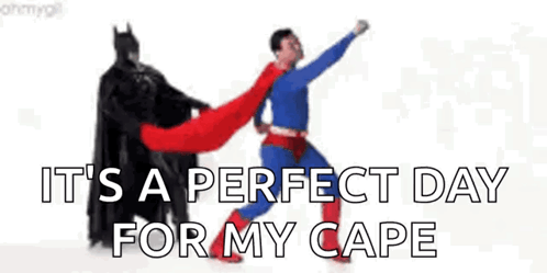 A Batman And Superman Are Standing Next To Each Other . GIF