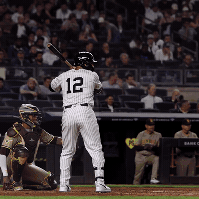 A Batter With The Number 12 On The Back Of His Jersey GIF
