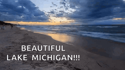 A Beach With The Words Beautiful Lake Michigan Written Above It GIF