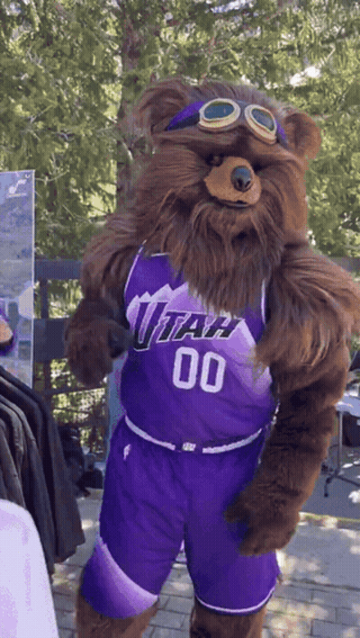 A Bear Mascot Wearing A Utah Jersey And Shorts GIF