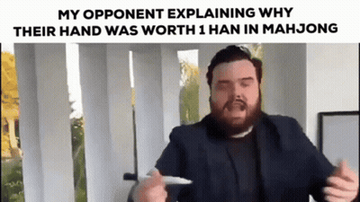 A Bearded Man In A Suit Is Explaining Why Their Hand Was Worth 1 Han In Mahjong . GIF