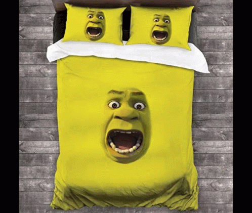 A Bed With A Duvet Cover And Pillows With Shrek 'S Face On Them GIF