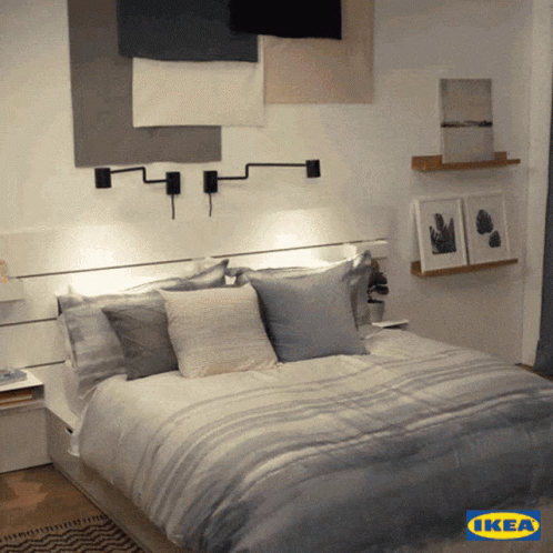 A Bed With A Ikea Logo On The Bottom Right GIF