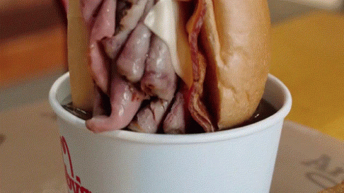 A Beef Sandwich Is In A Cup That Says Wendy 'S GIF