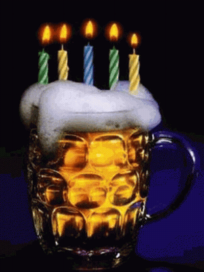 A Beer Mug With Candles On Top Of It And Foam On Top . GIF