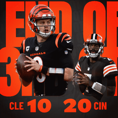 A Bengals Football Player Holding A Ball Next To Another Player GIF