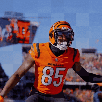 A Bengals Football Player Wearing Number 85 Jumps Into The Air GIF