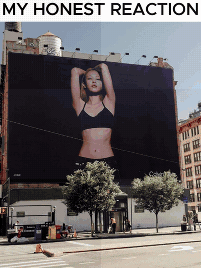 A Billboard For Calvin Klein Shows A Woman In A Bra GIF