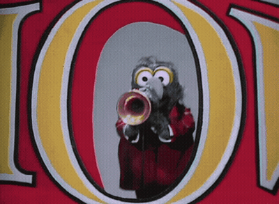 A Bird Is Playing A Trumpet In Front Of The Letter O On A Red And Yellow Background GIF