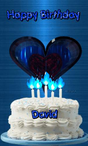 A Birthday Cake For David With Candles And A Heart On Top GIF
