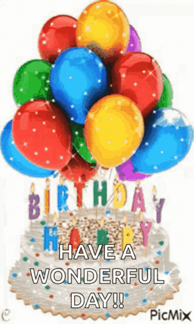 A Birthday Cake With Balloons And Candles On It GIF