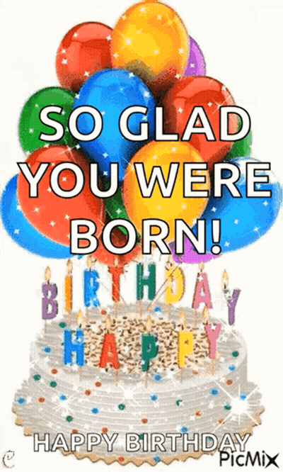 A Birthday Cake With Balloons And Candles On It . GIF