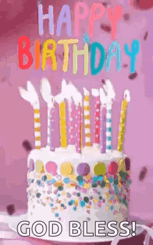 A Birthday Cake With Candles On It And The Words `` Happy Birthday God Bless ! '' GIF