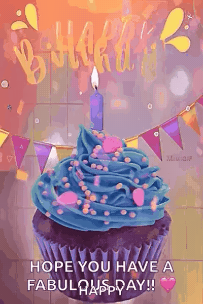 A Birthday Cupcake With Blue Frosting And A Candle GIF